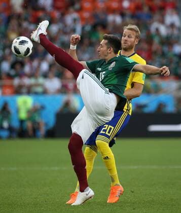 (180627) -- YEKATERINBURG, June 27, 2018 -- Hector Herrera (front) of Mexico competes during the 2018 FIFA World Cup WM Weltmeisterschaft Fussball Group F match between Mexico and Sweden in Yekaterinburg, Russia, June 27, 2018. ) (SP)RUSSIA-YEKATERINBURG-2018 WORLD CUP-GROUP F-MEXICO VS SWEDEN LixMing 