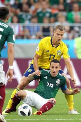 YEKATERINBURG, RUSSIA - JUNE 27, 2018: Mexico s Andres Guardado (front) and Sweden s Viktor Claesson in their 2018 FIFA World Cup WM Weltmeisterschaft Fussball First Stage Group F football match at Ekaterinburg Arena Stadium. Sergei Bobylev TASS  TS086ACA