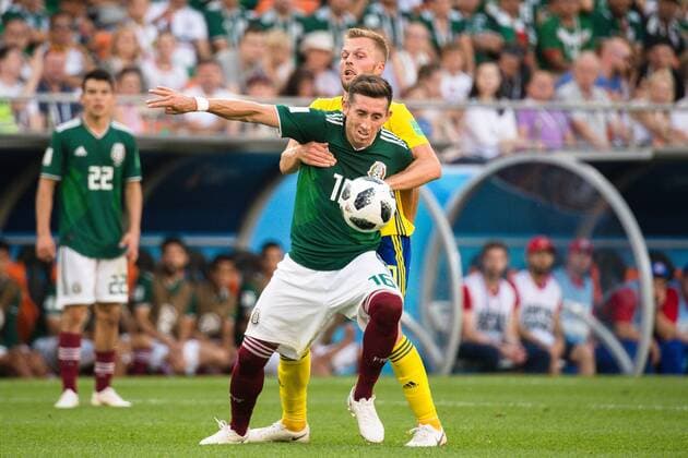 180627 Hector Herrera of Mexico and Sebastian Larsson of Sweden during the FIFA World Cup WM Weltmeisterschaft Fussball group stage match between Mexico and Sweden on June 27, 2018 in Ekaterinburg. Photo: Petter Arvidson BILDBYRN kod PA 87737 Copyright: PETTERxARVIDSON BB180627PA080