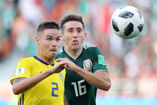 YEKATERINBURG, RUSSIA - JUNE 27, 2018: Sweden s Mikael Lustig (L) and Mexico s Hector Herrera in their 2018 FIFA World Cup WM Weltmeisterschaft Fussball First Stage Group F football match at Ekaterinburg Arena Stadium. Sergei Bobylev TASS  TS086AF9