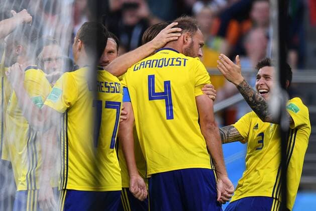 YEKATERINBURG, RUSSIA - JUNE 27, 2018: Sweden s Andreas Granqvist (2nd R), who has scored a goal, and Victor Lindeloef (R) in the 2018 FIFA World Cup WM Weltmeisterschaft Fussball First Stage Group F football match against Mexico at Ekaterinburg Arena Stadium. Donat Sorokin TASS  TS086B1E