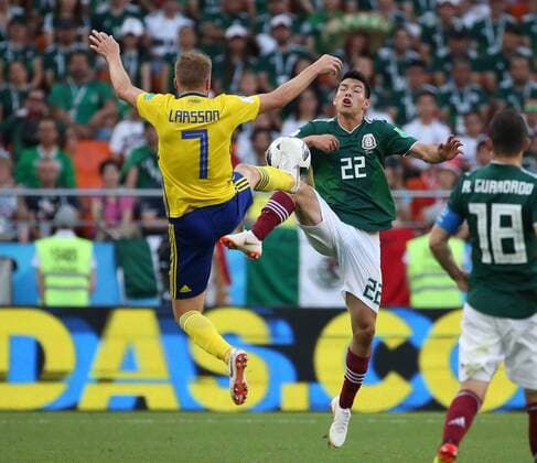 (180627) -- YEKATERINBURG, June 27, 2018 -- Hirving Lozano (R top) of Mexico vies with Sebastian Larsson (L top) of Sweden during the 2018 FIFA World Cup WM Weltmeisterschaft Fussball Group F match between Mexico and Sweden in Yekaterinburg, Russia, June 27, 2018. ) (SP)RUSSIA-YEKATERINBURG-2018 WORLD CUP-GROUP F-MEXICO VS SWEDEN LixMing 