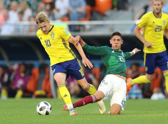 (180627) -- YEKATERINBURG, June 27, 2018 -- Edson Alvarez (R) of Mexico vies with Emil Forsberg of Sweden during the 2018 FIFA World Cup WM Weltmeisterschaft Fussball Group F match between Mexico and Sweden in Yekaterinburg, Russia, June 27, 2018. ) (SP)RUSSIA-YEKATERINBURG-2018 WORLD CUP-GROUP F-MEXICO VS SWEDEN LuxJinbo 