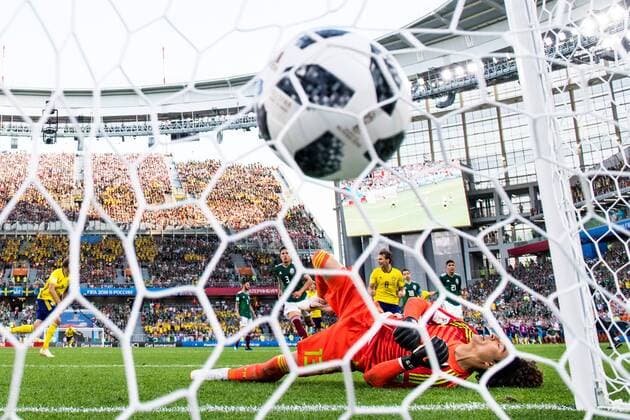 180627 Andreas Granqvist of Sweden scores 0-2 from the penalty spot behind goalkeeper Guillermo Ochoa of Mexico during the FIFA World Cup WM Weltmeisterschaft Fussball group stage match between Mexico and Sweden on June 27, 2018 in Ekaterinburg. Photo: Petter Arvidson BILDBYRN kod PA 87737 Copyright: PETTERxARVIDSON BB180627PA152