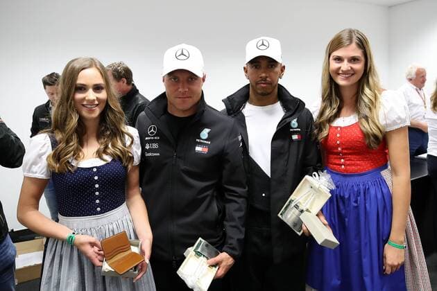 FORMULA 1 - GP of Austria 2018 SPIELBERG,AUSTRIA,29.JUN.18 - MOTORSPORTS, FORMULA 1 - Grand Prix of Austria, Red Bull Ring, free practice. Image shows Valtteri Bottas (FIN Mercedes) and Lewis Hamilton (GBR Mercedes) with girls. GEPAxpictures xChristianxWalgram