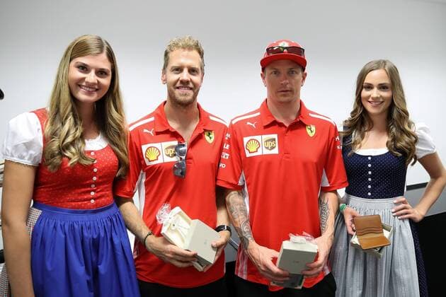 FORMULA 1 - GP of Austria 2018 SPIELBERG,AUSTRIA,29.JUN.18 - MOTORSPORTS, FORMULA 1 - Grand Prix of Austria, Red Bull Ring, free practice. Image shows Sebastian Vettel (GER Ferrari) and Kimi Raikkoenen (FIN Ferrari) with girls. GEPAxpictures xChristianxWalgram