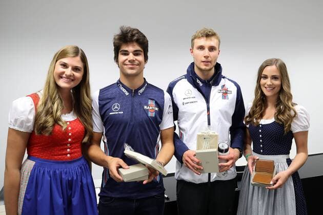 FORMULA 1 - GP of Austria 2018 SPIELBERG,AUSTRIA,29.JUN.18 - MOTORSPORTS, FORMULA 1 - Grand Prix of Austria, Red Bull Ring, free practice. Image shows Lance Stroll (CAN Williams) and Sergey Sirotkin (RUS Williams) with girls. GEPAxpictures xChristianxWalgram