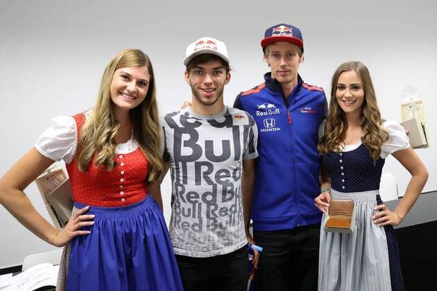 FORMULA 1 - GP of Austria 2018 SPIELBERG,AUSTRIA,29.JUN.18 - MOTORSPORTS, FORMULA 1 - Grand Prix of Austria, Red Bull Ring, free practice. Image shows Pierre Gasly (FRA Scuderia Toro Rosso) and Brendon Hartley (NZL Scuderia Toro Rosso) with girls. GEPAxpictures xChristianxWalgram