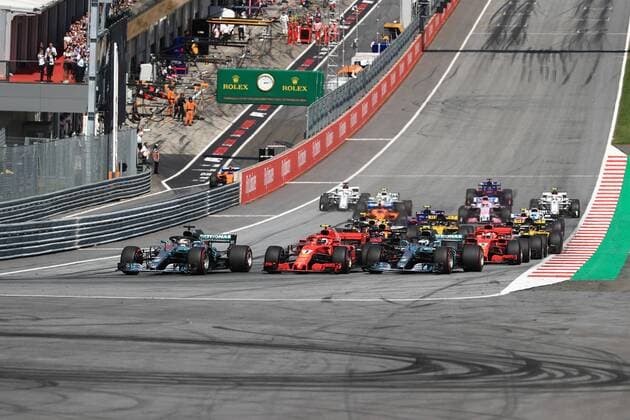 1st July 2018, Red Bull Ring, Spielberg, Austria; Austrian Formula One Grand Prix, Sunday race day; Mercedes AMG Petronas Motorsport, Valtteri Bottas, Lewis Hamilton and Scuderia Ferrari, Kimi Raikkonen go three wide into Turn 1 as Hamilton takes the lead  ActionPlus12043164 LeannexBoon