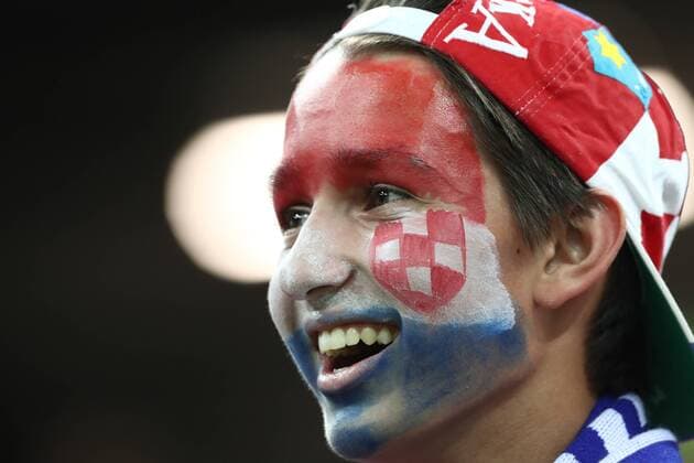 NIZHNY NOVGOROD, RUSSIA - JULY 1, 2018: Croatia s fan celebrates his team s victory in the 2018 FIFA World Cup WM Weltmeisterschaft Fussball Round of 16 football match against Denmark at Nizhny Novgorod Stadium. Stanislav Krasilnikov TASS  TS087816