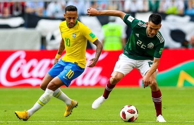 SAMARA, RUSSIA - JULY 2, 2018: Brazilâ€™s Neymar (L) and Mexicoâ€™s Hirving Lozano in their 2018 FIFA World Cup WM Weltmeisterschaft Fussball Round of 16 match at Samara Arena Stadium. Sergei Savostyanov TASS  TS087940