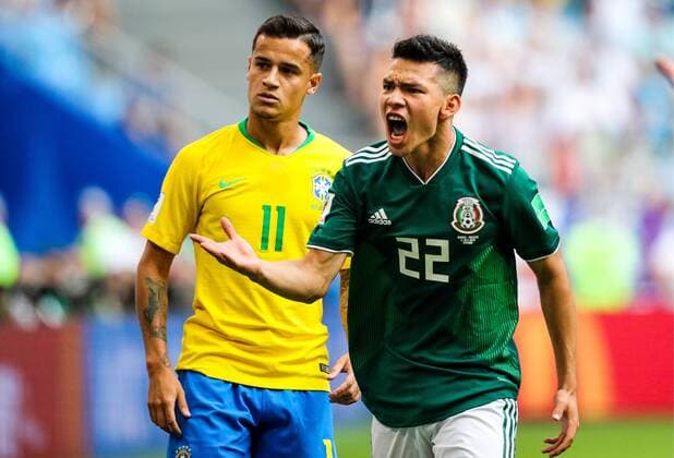 SAMARA, RUSSIA - JULY 2, 2018: Brazilâ€™s Philippe Coutinho (L) and Mexicoâ€™s Hirving Lozano in their 2018 FIFA World Cup WM Weltmeisterschaft Fussball Round of 16 match at Samara Arena Stadium. Sergei Bobylev TASS  TS087945
