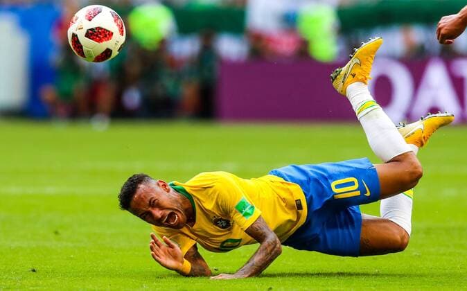 SAMARA, RUSSIA - JULY 2, 2018: Brazilâ€™s Neymar handsles Telstar Mechta, the official match ball, in their 2018 FIFA World Cup WM Weltmeisterschaft Fussball Round of 16 match against Mexico at Samara Arena Stadium. Sergei Savostyanov TASS  TS087967