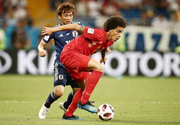 ROSTOV-ON-DON, RUSSIA â€“ JULY 2, 2018: Japan s Takashi Inui (L) and Belgium s Axel Witsel in action in their 2018 FIFA World Cup WM Weltmeisterschaft Fussball Round of 16 football match at Rostov Arena Stadium. Valery Sharifulin TASS  TS087AB6
