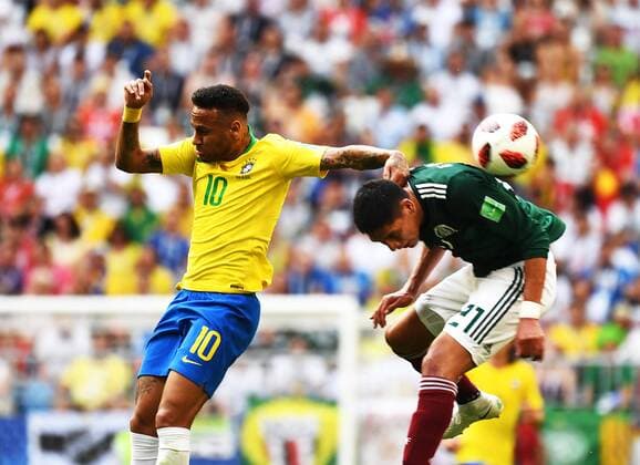 Neymar of Brazil, left, challenges Edson Alvarez of Mexico in their Round of 16 match during the 2018 FIFA World Cup WM Weltmeisterschaft Fussball in Samara, Russia, 2 July 2018. Brazil has roared into the World Cup quarter-finals with a 2-0 victory over Mexico as Neymar shone with a goal and an assist that dumped the central Americans out at the last 16 stage for the seventh straight occasion. The PSG forward slid home in the second half and then teed up Roberto Firmino late on as the five-times champions beat an otherwise stubborn Mexico, whose World Cup began with such promise with a victory over champions Germany, but ended in familiar fashion in the first knockout round. Brazil beats Mexico 2-0 to progress as Neymar shows his brilliant best and frustrating worst  20180703_21522