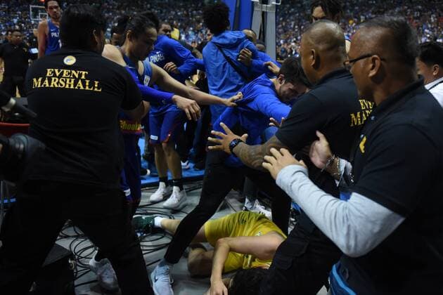 July 2, 2018 - Biulcan, Philippines - Security personnel attempt to pull players away from Chris Goulding of Australia on the flooer as players figured in a brawl during the match between Australia and the Philippines for the FIBA Asian Qualifiers held at the Philippine Arena in the province of Bulacan, north of Manila in 02 July 2018. Australia beat the Philippines by default following a brawl in the third quarter that shocked basketball fans all over the world. Philippines v Australia - FIBA Asian Qualifiers  - ZUMAn230 20180702_zaa_n230_325 Copyright: xGeorgexCalvelox