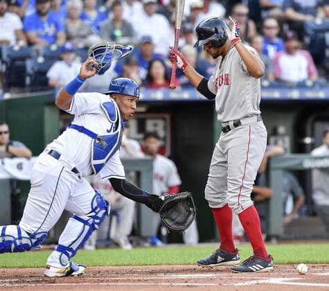 July 7, 2018 - Kansas City, MO, USA - Kansas City Royals catcher Salvador Perez, left, picks up a dropped strike in front of the Boston Red Sox s Xander Bogaerts, before throwing Andrew Benintendi out trying to steal second to end the top of the first inning at Kauffman Stadium in Kansas City, Mo., on Saturday, July 7, 2018. Boston at Kansas City - ZUMAm67_ 20180707_zaf_m67_033 Copyright: xJohnxSleezerx