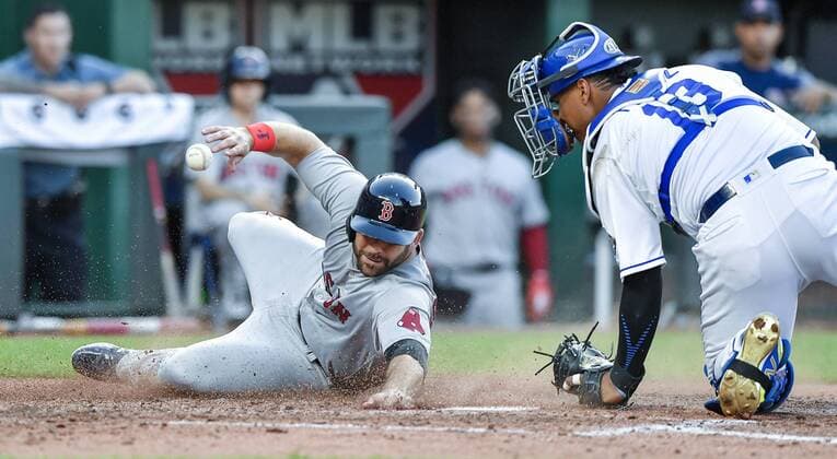 July 7, 2018 - Kansas City, MO, USA - The Boston Red Sox s Mitch Moreland, left, scores as Kansas City Royals catcher Salvador Perez loses the ball on a three-run double by Boston s Xander Bogaerts in the fifth inning at Kauffman Stadium in Kansas City, Mo., on Saturday, July 7, 2018. Boston at Kansas City - ZUMAm67_ 20180707_zaf_m67_041 Copyright: xJohnxSleezerx
