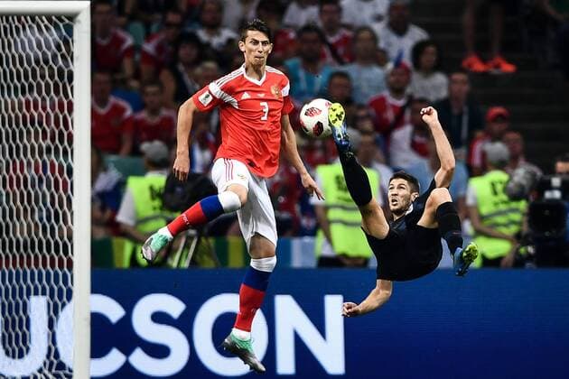Andrej Kramaric of Croatia, right, kicks the ball to shoot against Russia in their quarterfinal match during the 2018 FIFA World Cup WM Weltmeisterschaft Fussball in Sochi, Russia, 7 July 2018. Russia¡¯s 2018 World Cup is over. The hosts are out. Their campaign ended just as it had climaxed six days earlier, on penalties. But only after 120 minutes of twists and turns ¨C 120 minutes befitting of the tournament¡¯s most unforeseen run. Russia had been ahead, then behind, then, for the second straight elimination match against a favored European side, level and headed to the penalty spot. But this time it fell, by the finest of margins, to Croatia. Ivan Rakitic, for the second time in seven days, stepped up to the penalty spot in the final round of a shootout. And just like he had on Sunday, he sent Croatia through in the World Cup knockout rounds, this time to the semifinals, where England awaits. *** Local Caption *** Croatia ends Russia s World Cup run, squeaks through to semis on penalties  20180708_42537