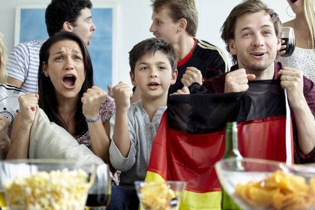 German football supporters watching match at home  Copyright: BelenxMajdalani B63363938