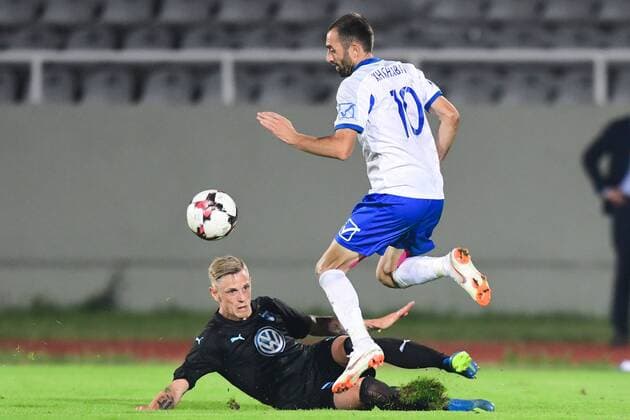 180710 Sören Rieks of Malmö FF slide tackles Xhevdet Shabani of Drita during the UEFA Champions League qualifying match between FC Drita and Malmö FF on July 10, 2018 in Pristina. Photo: Ludvig Thunman BILDBYRAN kod LT 92086 Copyright: LUDVIGxTHUNMAN BB180710LT044