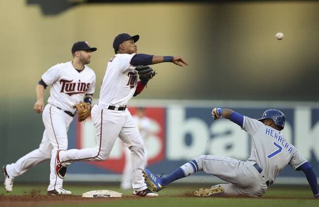 July 10, 2018 - Minneapolis, MN, USA - Minnesota Twins shortstop Jorge Polanco completes a double play over the Kansas City Royals Rosell Herrera (7) in the second inning on Tuesday, July 10, 2018, at Target Field in Minneapolis. Kansas City at Minnesota - ZUMAm67_ 20180710_zaf_m67_022 Copyright: xJeffxWheelerx