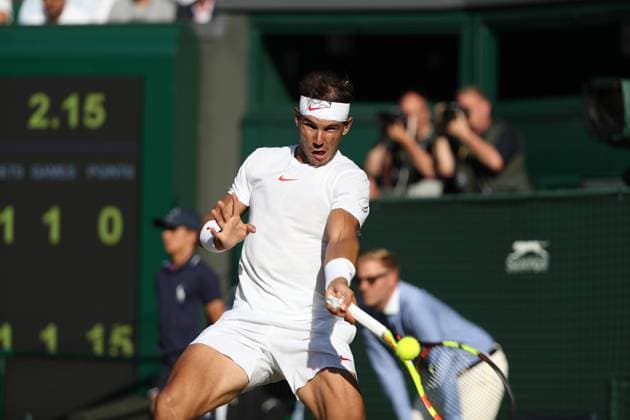 11th July 2018, All England Lawn Tennis and Croquet Club, London, England; The Wimbledon Tennis Championships, Day 9; Rafael Nadal (Esp) returns versus Juan Mart& xed;n del Potro (Arg)  ActionPlus12046613 JohnxPatrickxFletcher