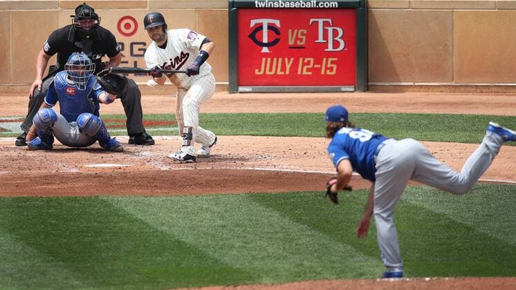 July 11, 2018 - Minneapolis, MN, USA - The Minnesota Twins Brian Dozier bunts for single in the third inning Kansas City Royals relief pitcher Burch Smith at Target Field in Minneapolis on Wednesday, July 11, 2018. The Twins won, 8-5. Kansas City at Minnesota - ZUMAm67_ 20180711_zaf_m67_005 Copyright: xJerryxHoltx