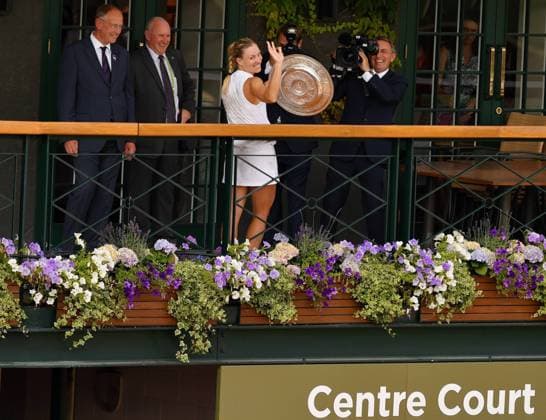 (180715) -- LONDON, July 15, 2018 -- Angelique Kerber (3rd L) of Germany holds the trophy after winning the final of the Ladies Singles against Serena Williams of the United States at the Wimbledon Championships 2018 in London, Britain, on July 14, 2018. Angelique Kerber won 2-0 to claim the title. ) (SP)BRITAIN-LONDON-TENNIS-WIMBLEDON CHAMPIONSHIPS 2018-DAY 12 GuoxQiuda 