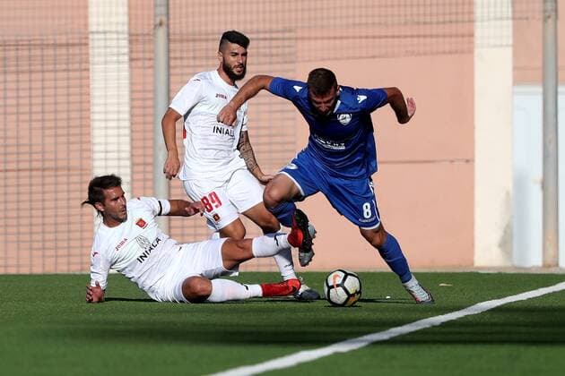 17 07 2018 - National Stadium, Ta Qali, Malta UEFA Champions League 2018 2019 First Qualifying Round, 2nd Leg - Valletta FC v FK Kuk‘si Vangjel Zguro of FK Kuk‘si (R) is challenged by Valletta FC players Santiago Malano (L) and Mario Fontanella (R) during the UEFA Champions League 2018 19 First Qualifying Round, 2nd Leg match between Valletta FC of Malta FK Kuk‘si of Albania, at the Centenary Stadium, Ta Qali, Malta on 17 July, 2018. FK Kuk‘si drew 1-1 against Valletta FC and qualified on the away goals rule to progress into the UEFA Champions League competition. Valletta FC v FK Kuk‘si - UEFA Champions League 2018 19 UCL_18_19