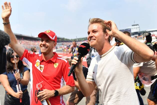 Sebastian VETTEL,GER (Scuderia Ferrari) und Nico ROSBERG (EX Formel 1 Weltmeister) gruessen die Fans,winkend,winken, umringt von Fotografen. Formel 1:GP von Deutschland,,Rennen, Hockenheimring,Saison 2018,am 22.07.2018.