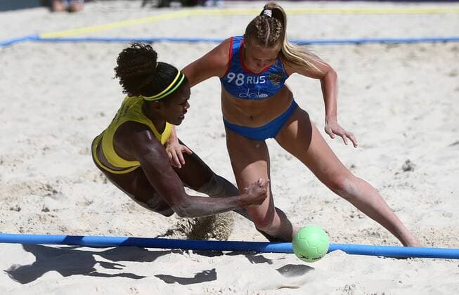 KAZAN, RUSSIA - JULY 24, 2018: Brazil s Renata Santiago (L) and Russia s Anastasia Makina in action in their beach handball match at the 2018 IHF Menâ€™s and Womenâ€™s Beach Handball World Championships held in Kazan. Yegor Aleyev TASS  TS08A890