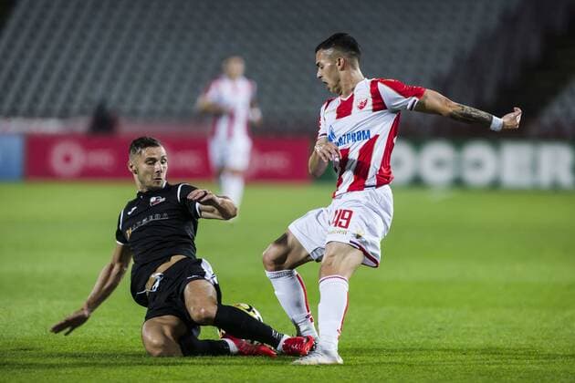 24th July 2018, Rajko Mitic Stadium, Belgrade, Serbia; UEFA Champions League, second qualifying round, 1st leg, Red Star Belgrade versus FK Suduva; Andro Svrljuga of Suduva misstimes the tackle on Nemanja Radonjic of Red Star Belgrade  ActionPlus12050287 NikolaxKrstic