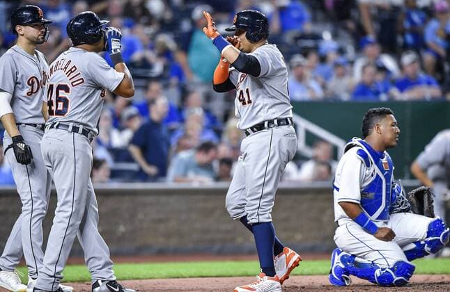July 24, 2018 - Kansas City, MO, USA - The Detroit Tigers Victor Martinez (41) celebrates his three-run home run with Jeimer Candelario and Nicholas Castellanos behind Kansas City Royals catcher Salvador Perez in the seventh inning on Tuesday, July 24, 2018, at Kauffman Stadium in Kansas City, Mo. Detroit at Kansas City - ZUMAm67_ 20180724_zaf_m67_055 Copyright: xJohnxSleezerx