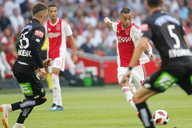 Dario Maresic of SK Sturm Graz, Hakim Ziyech of Ajax during the UEFA Champions League second round qualifying first leg match between Ajax Amsterdam and Sturm Graz at the Johan Cruijff Arena on July 25, 2018 in Amsterdam, The Netherlands UEFA Champions League 2018 2019 xVIxVIxImagesx xTomxBodexMultimediaxIVx 11586165