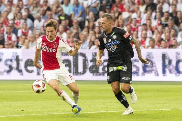 AMSTERDAM, Ajax - Sturm Graz , football, season 2018-2019, Johan Cruijff Arena , 25-07-2018, Johan Cruijff ArenA , UEFA Champions League second qualifying round , 1st leg , Ajax player Carel Eiting and Sturm Graz player Lukas Spendlhofer during the match Ajax - Sturm Graz Ajax - Sturm Graz  x2363575x