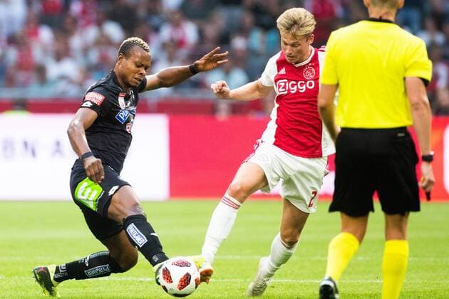 Emeka Friday Eze of SK Sturm Graz, Frenkie de Jong of Ajax during the UEFA Champions League second round qualifying first leg match between Ajax Amsterdam and Sturm Graz at the Johan Cruijff Arena on July 25, 2018 in Amsterdam, The Netherlands UEFA Champions League 2018 2019 xVIxVIxImagesx xTomxBodexMultimediaxIVx 11586504