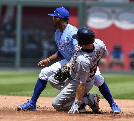 July 25, 2018 - Kansas City, MO, USA - Detroit Tigers John Hicks reaches second as the ball bounces past Kansas City Royals shortstop Alcides Escobar on a double in the second inning on Wednesday, July 25, 2018 at Kauffman Stadium in Kansas City, Mo. Detroit Tigers vs. Kansas City Royals - ZUMAm67_ 20180725_zaf_m67_011 Copyright: xJohnxSleezerx