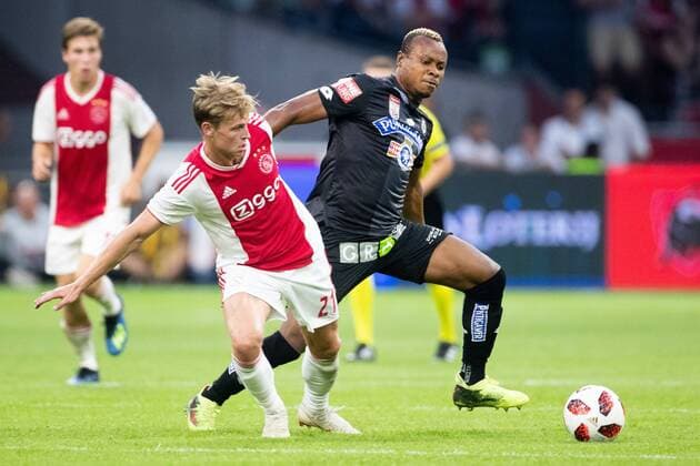 Frenkie de Jong of Ajax, Emeka Friday Eze of SK Sturm Graz during the UEFA Champions League second round qualifying first leg match between Ajax Amsterdam and Sturm Graz at the Johan Cruijff Arena on July 25, 2018 in Amsterdam, The Netherlands UEFA Champions League 2018 2019 xVIxVIxImagesx xTomxBodexMultimediaxIVx 11586642