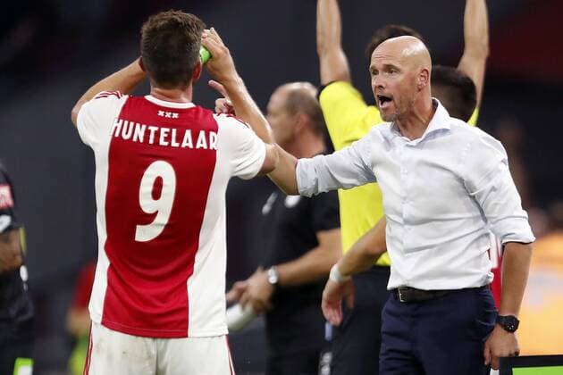 (L-R) Klaas Jan Huntelaar of Ajax, Ajax coach Erik ten Hag during the UEFA Champions League second round qualifying first leg match between Ajax Amsterdam and Sturm Graz at the Johan Cruijff Arena on July 25, 2018 in Amsterdam, The Netherlands UEFA Champions League 2018 2019 xVIxVIxImagesx xMauricexvanxSteenxIVx 11586645