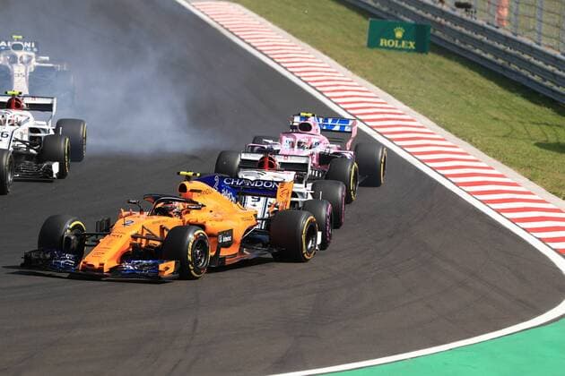 29th July 2018, Hungaroring, Mogyorod, Hungary; Hungarian Formula One Grand Prix, race day; Alfa Romeo Sauber F1 Team, Marcus Ericsson lands close behind McLaren, Stoffel Vandoorne  ActionPlus12051523 Octane