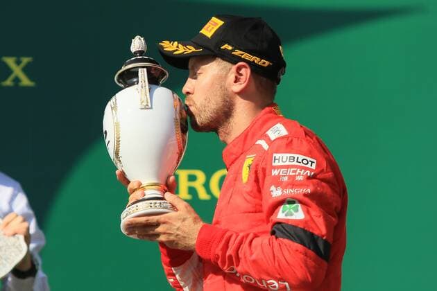29th July 2018, Hungaroring, Mogyorod, Hungary; Hungarian Formula One Grand Prix, race day; Scuderia Ferrari, Sebastian Vettel on the podium accepts his trophy as he comes second place  ActionPlus12051621 Octane