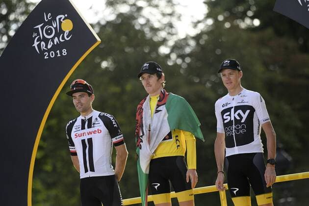 Dutch Tom Dumoulin of Team Sunweb, British Geraint Thomas of Team Sky wearing the yellow jersey of overall leader, with a Welsh flag over his shoulders and British Chris Froome of Team Sky celebrate on the podium after the last stage of the 105th edition of the Tour de France cycling race, 116km from Houilles to Paris, France, Sunday 29 July 2018. This year s Tour de France takes place from July 7th to July 29th. YORICKxJANSENS  x05395081x