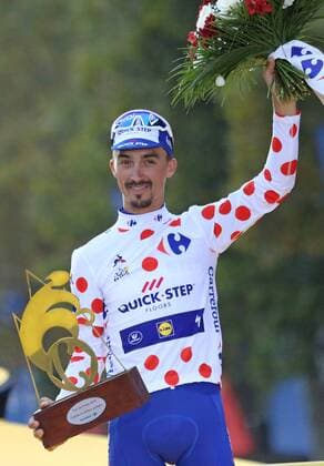 Julian Alaphilippe of France arrives on the presentation podium after winning the Best Climber jersey at the Tour de France in Paris on July 29, 2018. Geraint Thomas claimed his first Tour de France victory, becoming the first Welshman to win the event.  PAR20180729030 DAVIDxSILPA