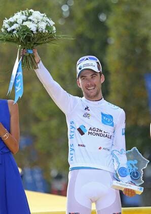 Pierre Roger Latour of France arrives on the presentation podium after winning the Best Young Rider jersey at the Tour de France in Paris on July 29, 2018. Geraint Thomas claimed his first Tour de France victory, becoming the first Welshman to win the event.  PAR20180729031 DAVIDxSILPA