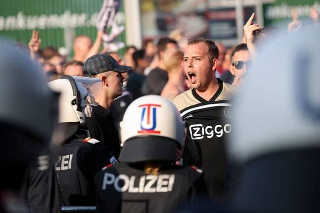 SOCCER - UEFA CL quali, Sturm vs Ajax GRAZ,AUSTRIA,01.AUG.18 - SOCCER - UEFA Champions League qualification, SK Sturm Graz vs AFC Ajax Amsterdam. Image shows fans of Ajax and police. GEPAxpictures xChristianxWalgram