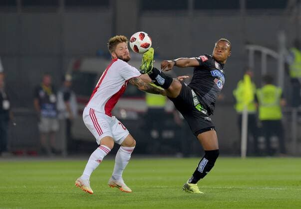 SOCCER - UEFA CL quali, Sturm vs Ajax GRAZ,AUSTRIA,01.AUG.18 - SOCCER - UEFA Champions League qualification, SK Sturm Graz vs AFC Ajax Amsterdam. Image shows Lasse Schoene (Ajax) and Emeka Friday Eze (Sturm). GEPAxpictures xMichaelxRiedler