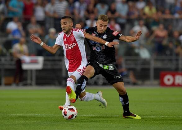 SOCCER - UEFA CL quali, Sturm vs Ajax GRAZ,AUSTRIA,01.AUG.18 - SOCCER - UEFA Champions League qualification, SK Sturm Graz vs AFC Ajax Amsterdam. Image shows Hakim Ziyech (Ajax) and Sandi Lovric (Sturm). GEPAxpictures xMichaelxRiedler