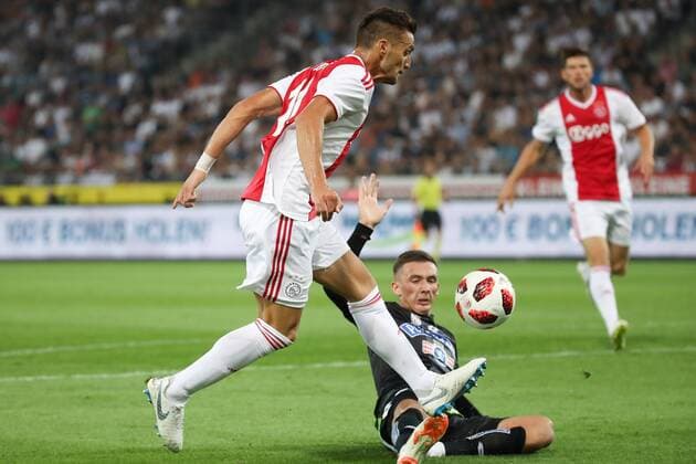 SOCCER - UEFA CL quali, Sturm vs Ajax GRAZ,AUSTRIA,01.AUG.18 - SOCCER - UEFA Champions League qualification, SK Sturm Graz vs AFC Ajax Amsterdam. Image shows Dusan Tadic (Ajax) and Dario Maresic (Sturm). GEPAxpictures xChristianxWalgram