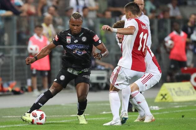 SOCCER - UEFA CL quali, Sturm vs Ajax GRAZ,AUSTRIA,01.AUG.18 - SOCCER - UEFA Champions League qualification, SK Sturm Graz vs AFC Ajax Amsterdam. Image shows Emeka Friday Eze (Sturm) and Dusan Tadic (Ajax). GEPAxpictures xChristianxWalgram